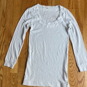 Rounded neckline. Light blue color